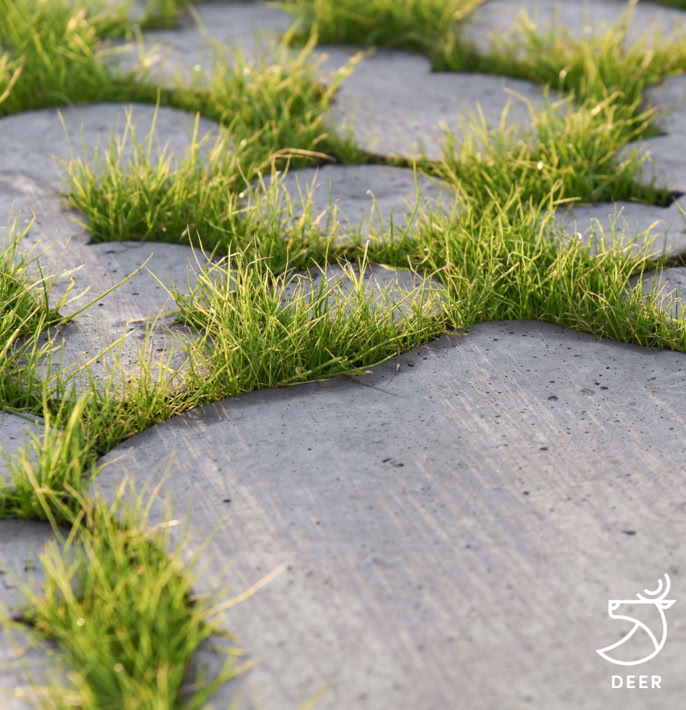 Dalles de béton avec de l'herbe poussant entre les interstices.